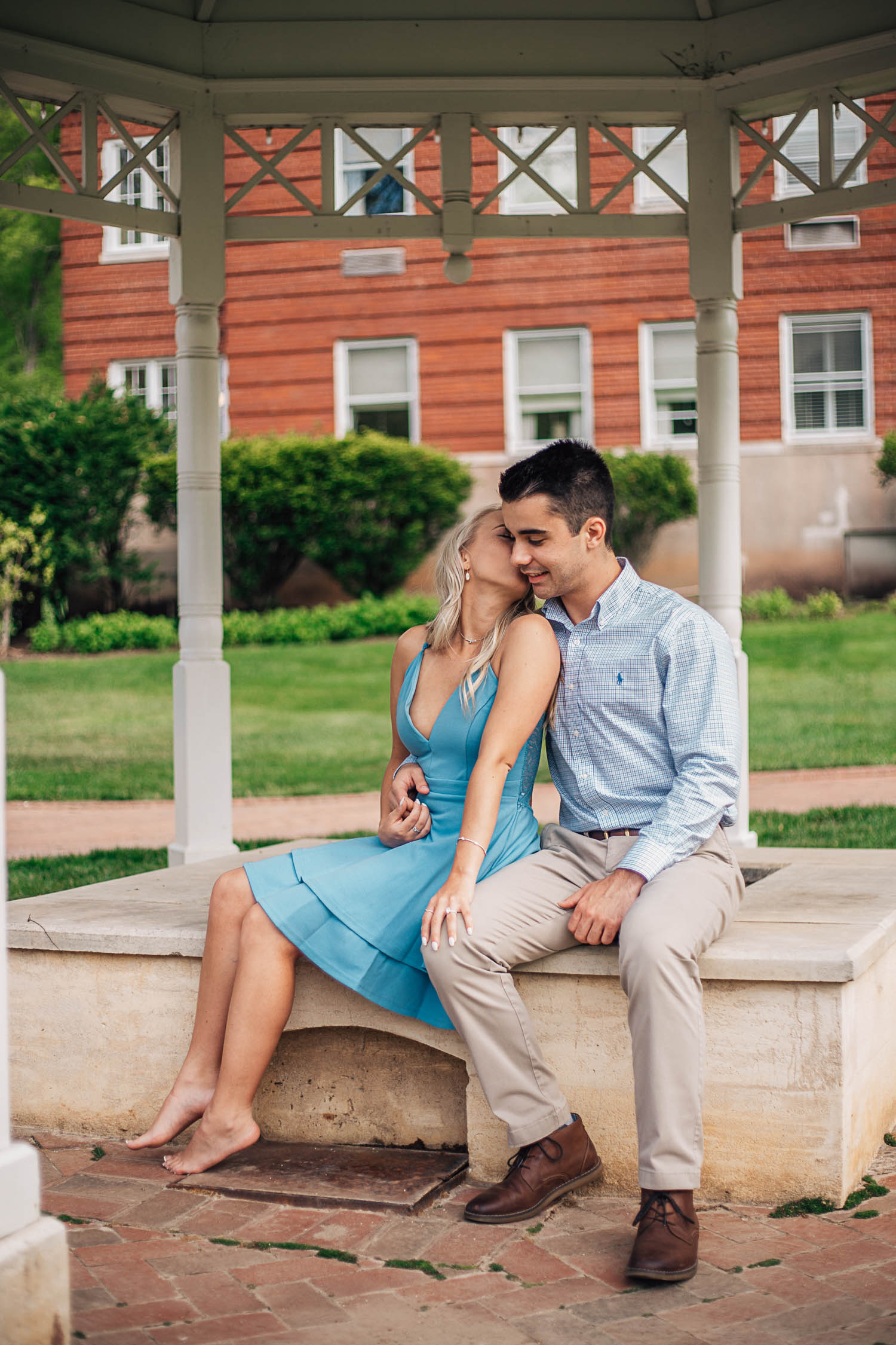 couple at the omni resort homestead cuddling together for engagement photos