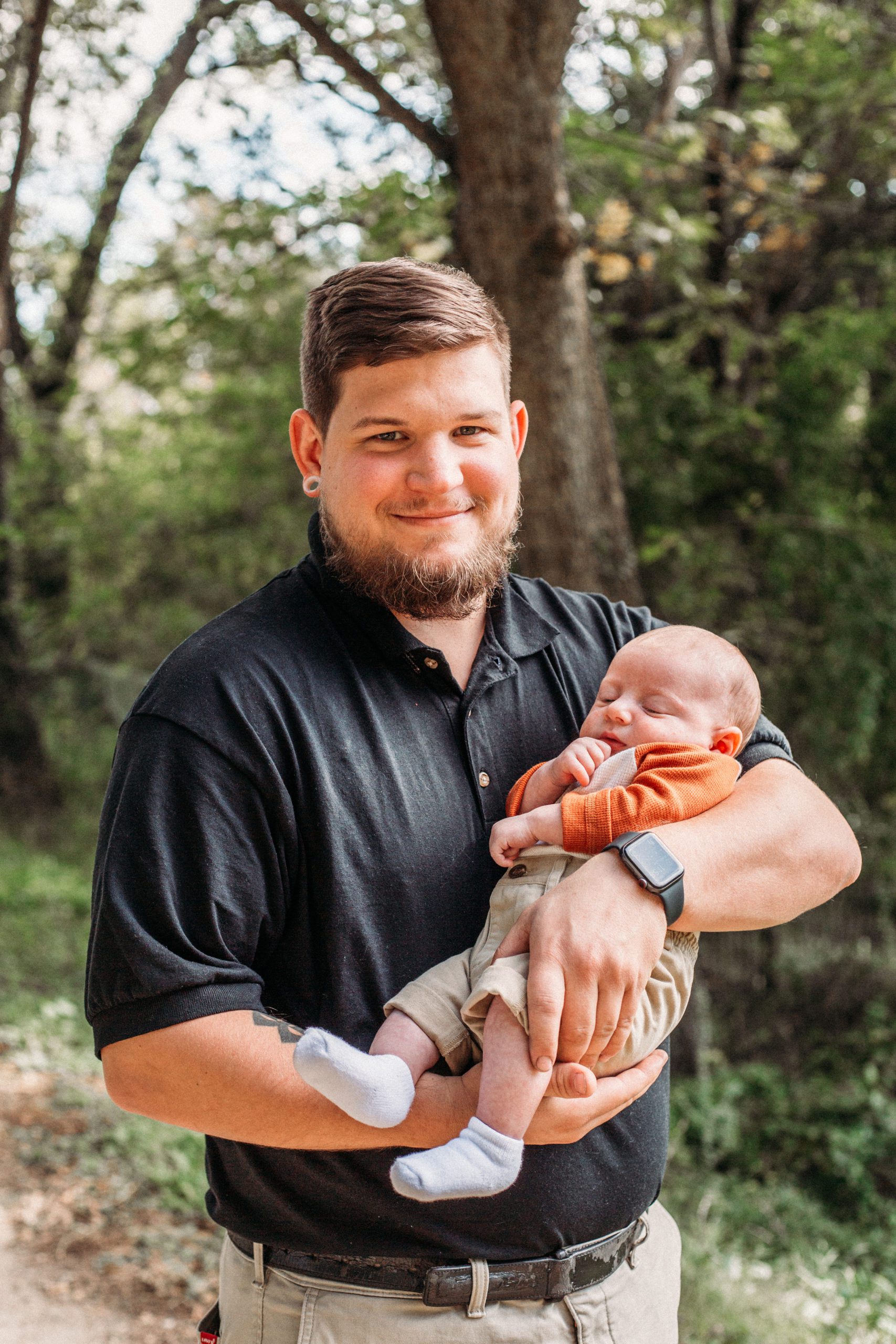 Hampton Roads family photos of father and baby son together outside on a dirt path