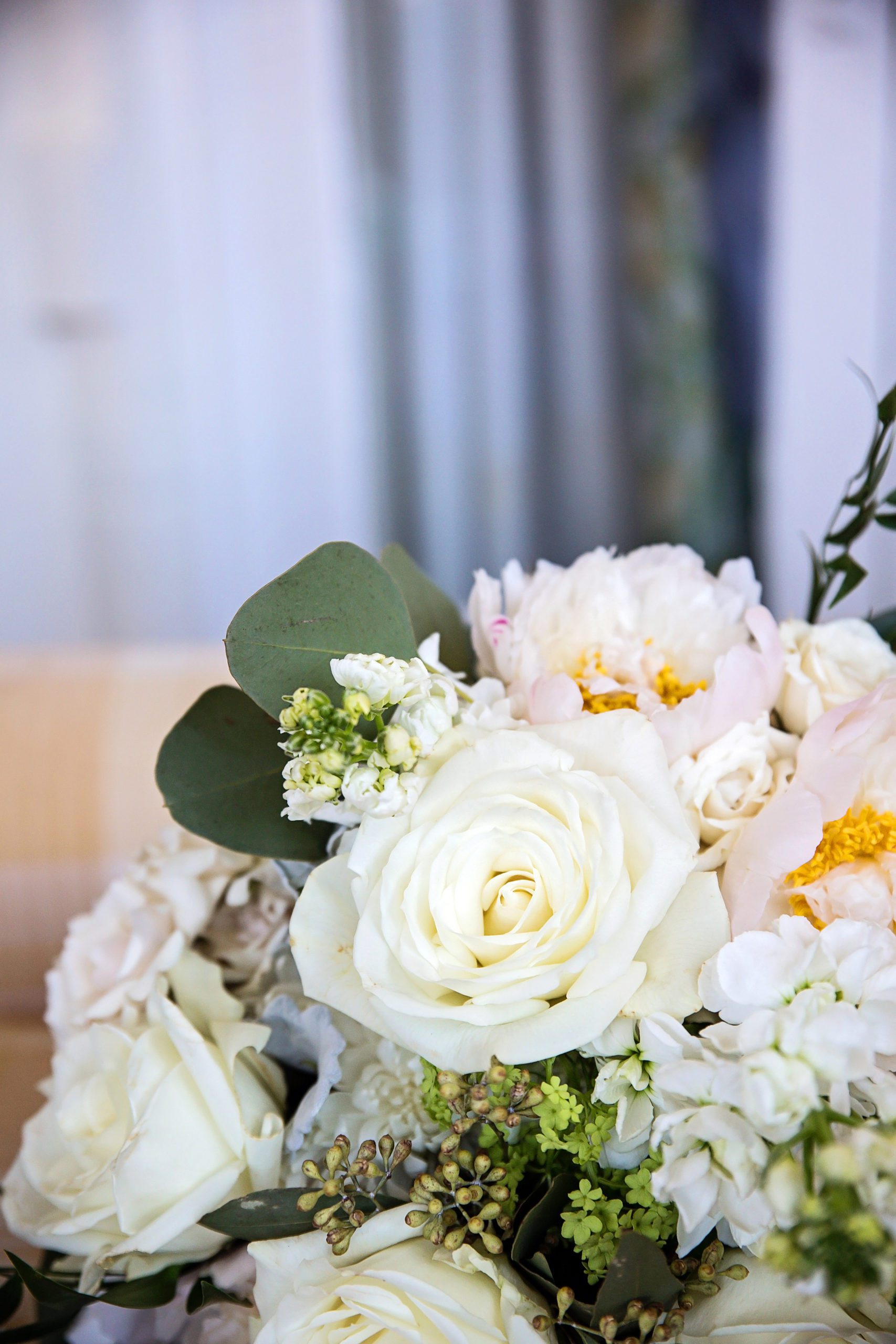 bridal florals of white and light pink with eucalyptus